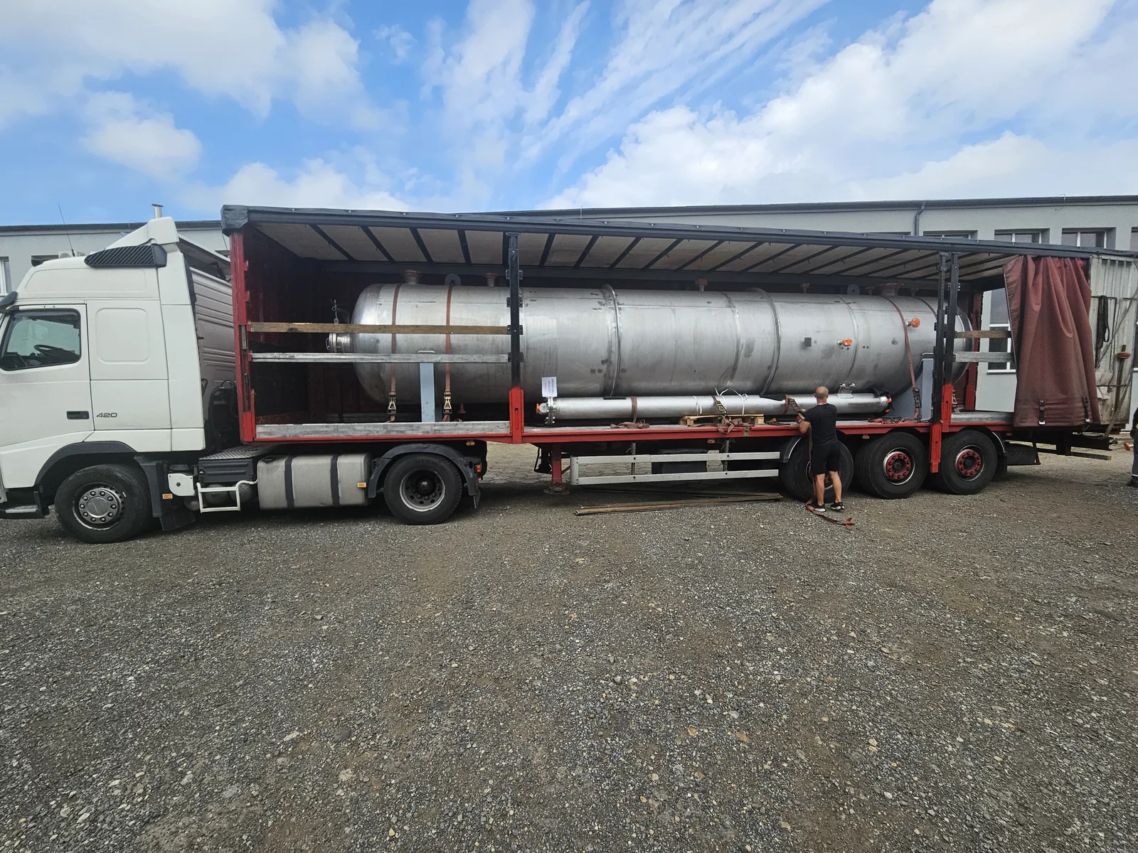 Vessel loaded onto a flatbed trailer for transport