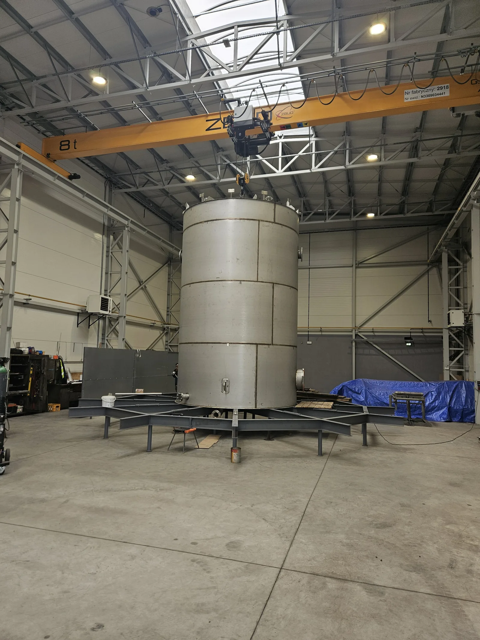 Vessel suspended from the overhead crane hook in the hall